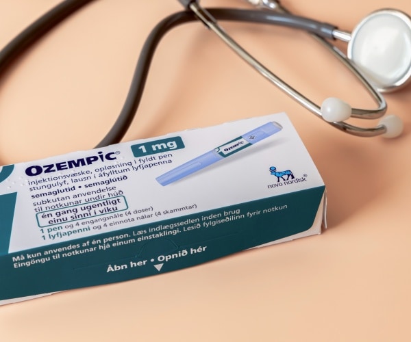 Ozempic pen and a stethoscope