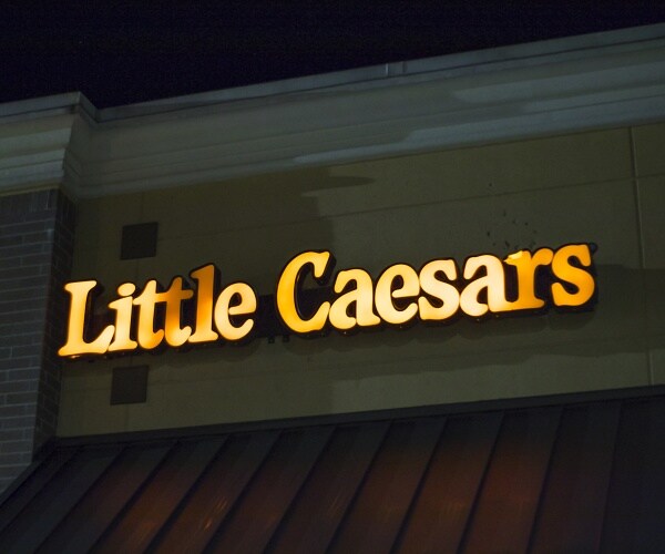 little caesars sign lit up at night