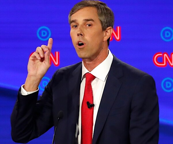 beto o'rourke points up and speaks during a democratic presidential primary debate this summer