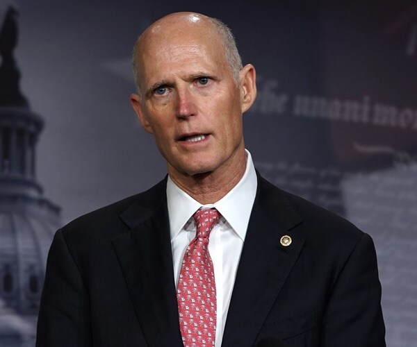 sen. rick scott speaks during a news conference