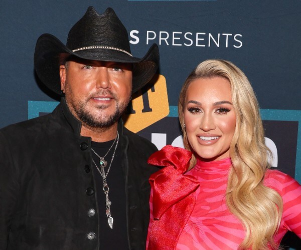 jason and brittany aldean at an awards ceremony