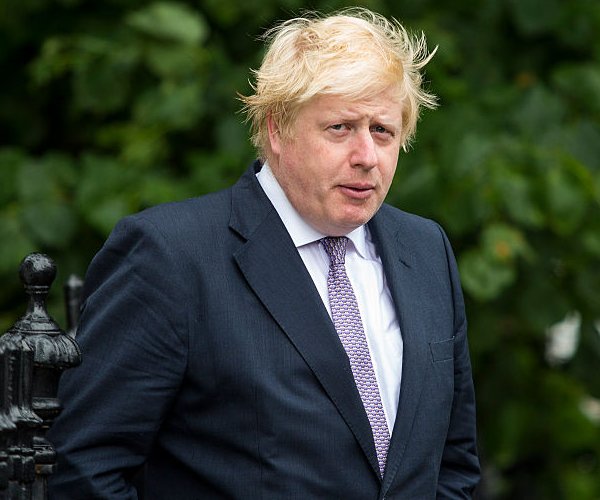 former british prime minister boris johnson looks on