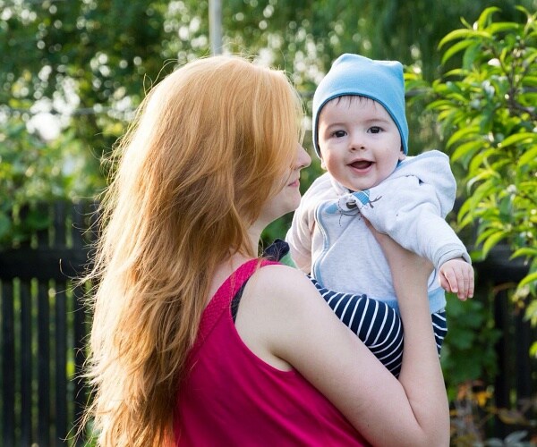 mom playing with baby