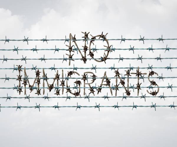 barbed wire with the words immigration ban