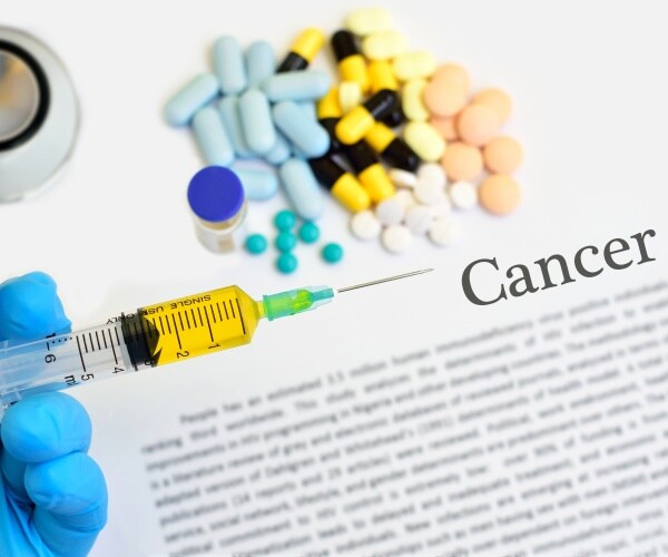 Cancer treatment, pills, syringe