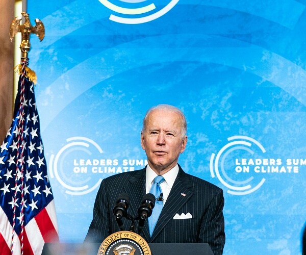 joe biden speaks from podium in east room