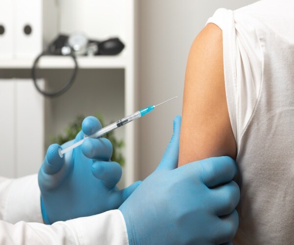 woman receiving COVID vaccine