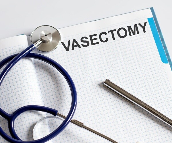 pad with header 'vasectomy', stethoscope, pen