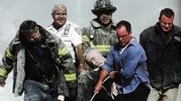 Image of first responders carrying Father Mychal Judge on 9/11.